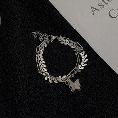 Butterfly pendant layered leaf bracelet
