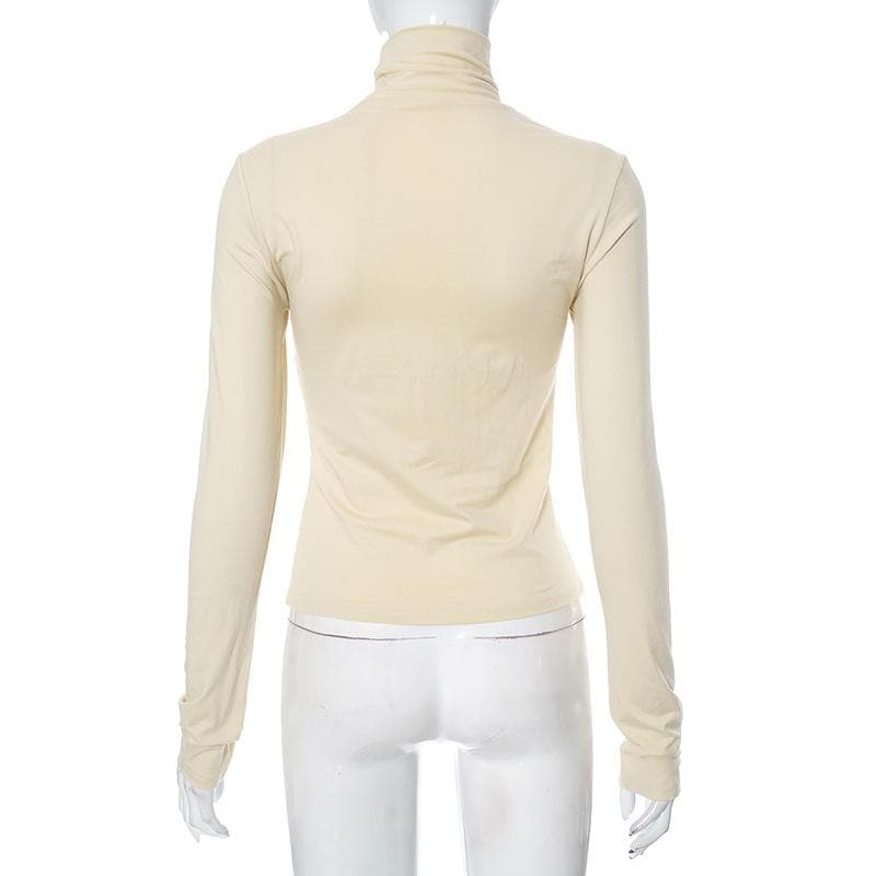 Metal applique turtle neck long sleeve solid top
