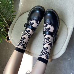 Solid flower pattern mesh long socks